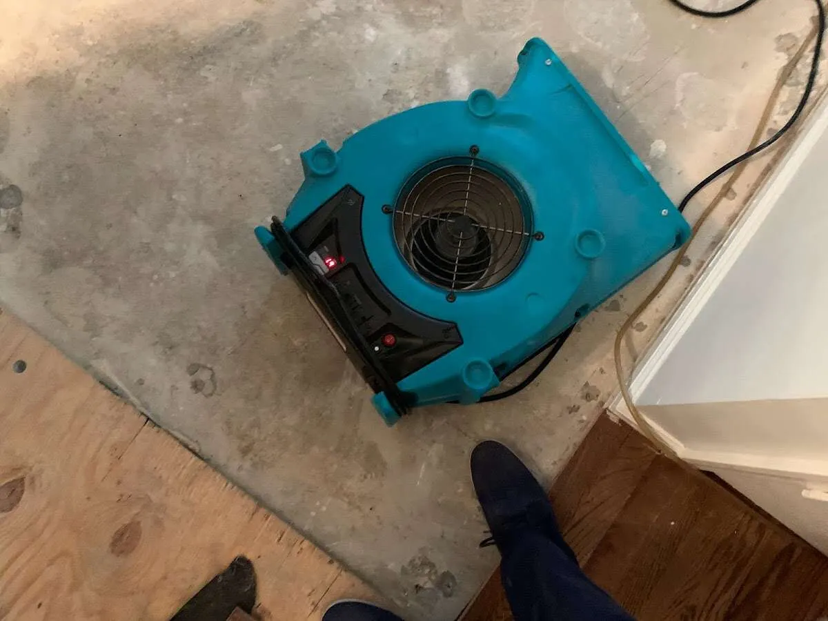 Air mover drying subfloor during Leak Detection & Repair in Plano
